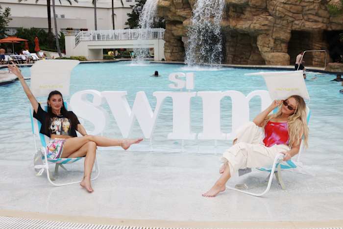 Nicole Williams English and Camille Kostek in Sunflow chairs.